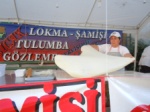 stretching the dough for Şamişi, a sweet baked in oil